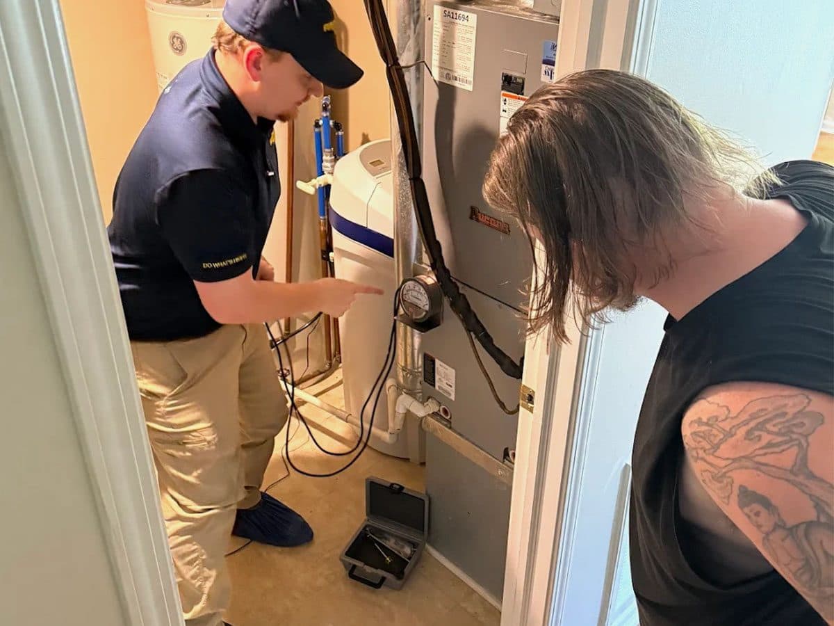 Armor Air technician servicing a high-efficiency furnace