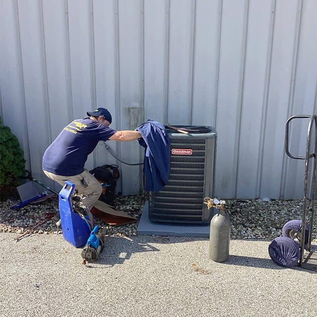 Armor Air outdoor heat pump unit installed beside a home